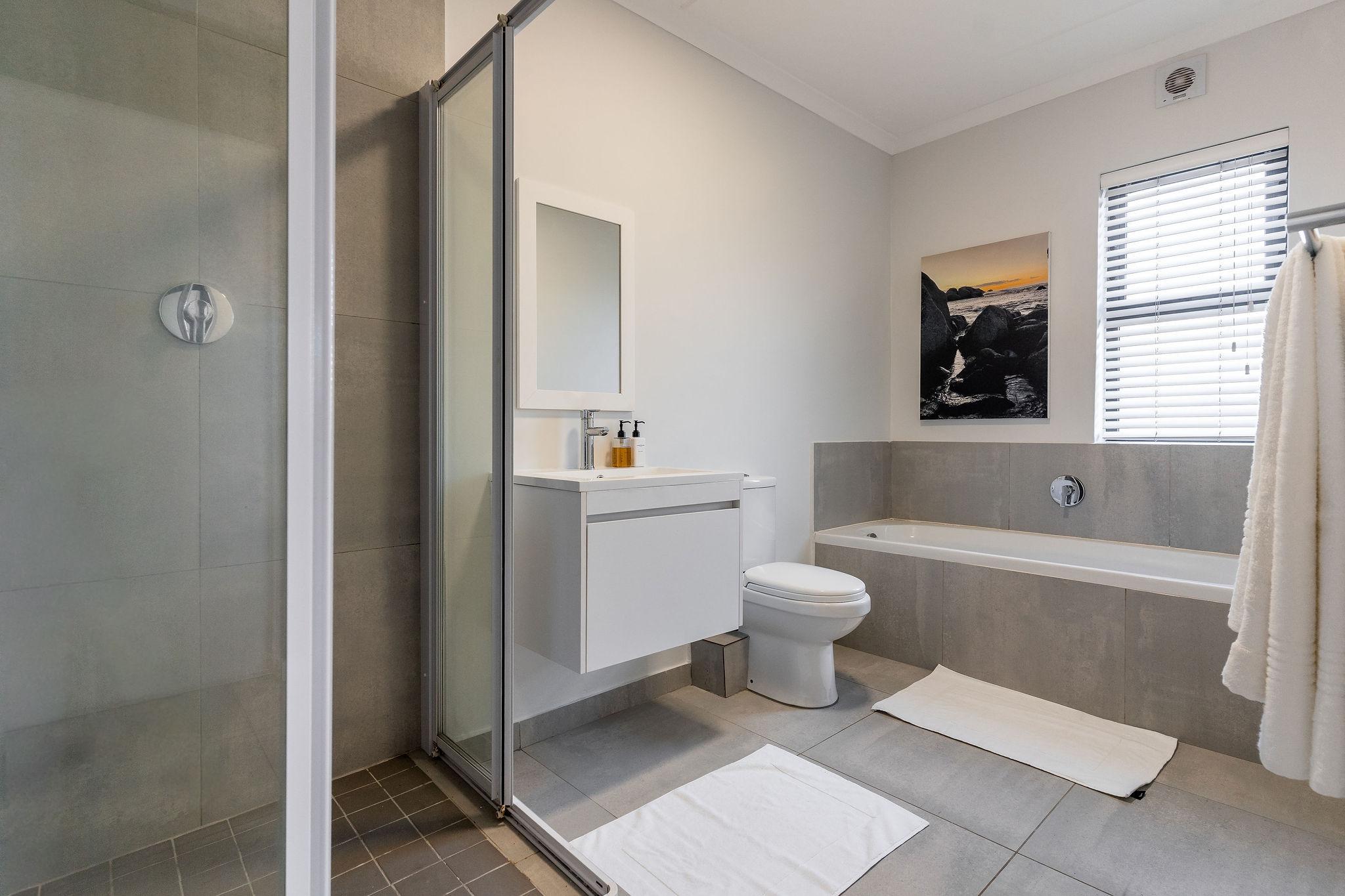 Cape Perlant bathroom with walk-in shower and bathtub