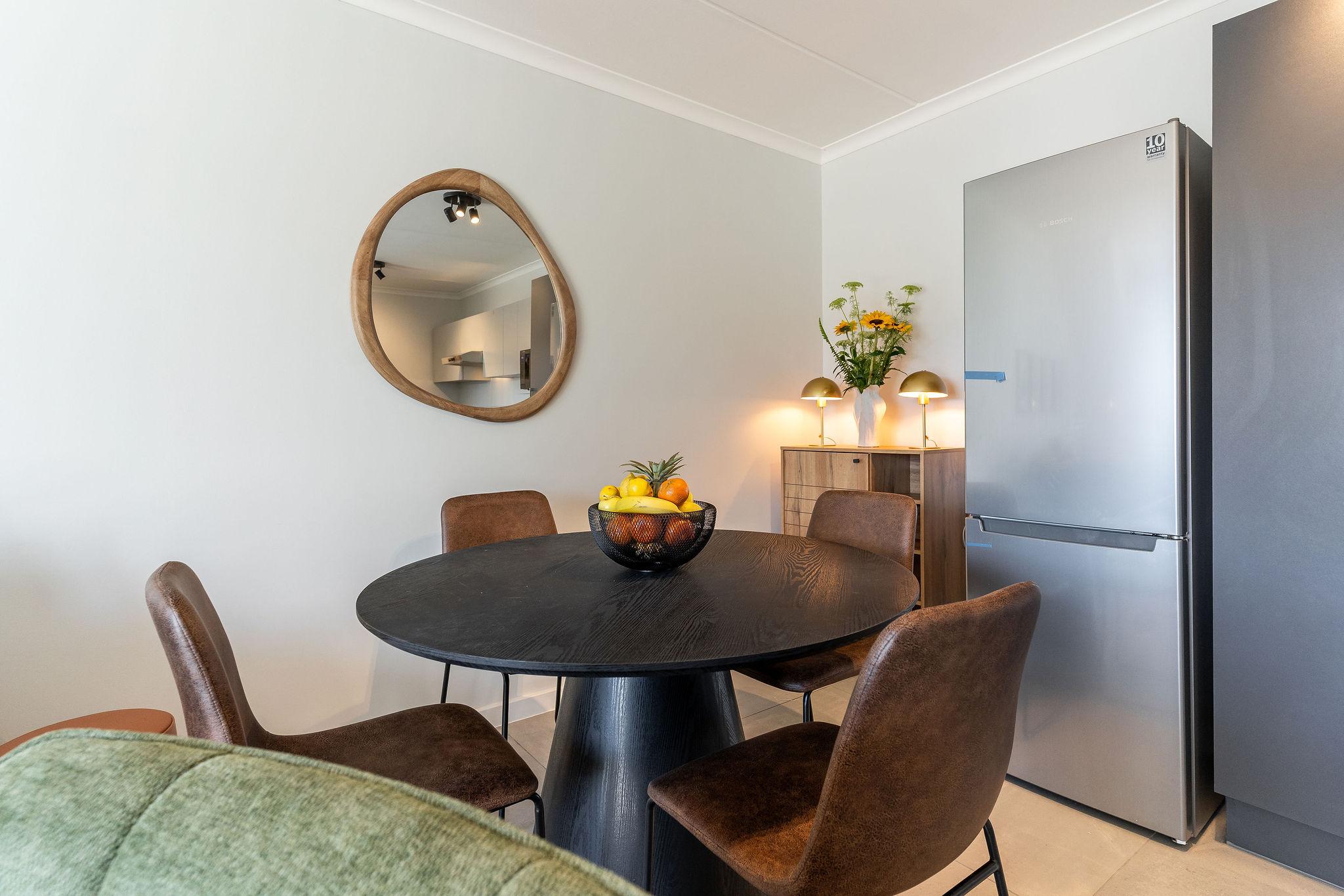 Cape Perlant dining area with a round table for four