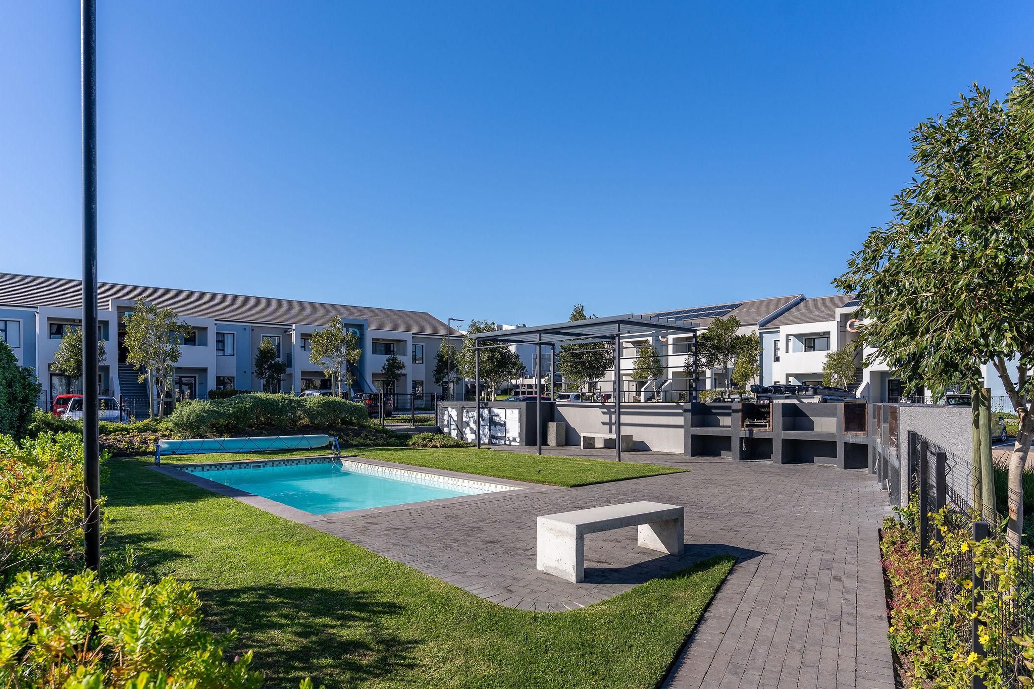 Communal swimming pool and braai area at Quinta Estate