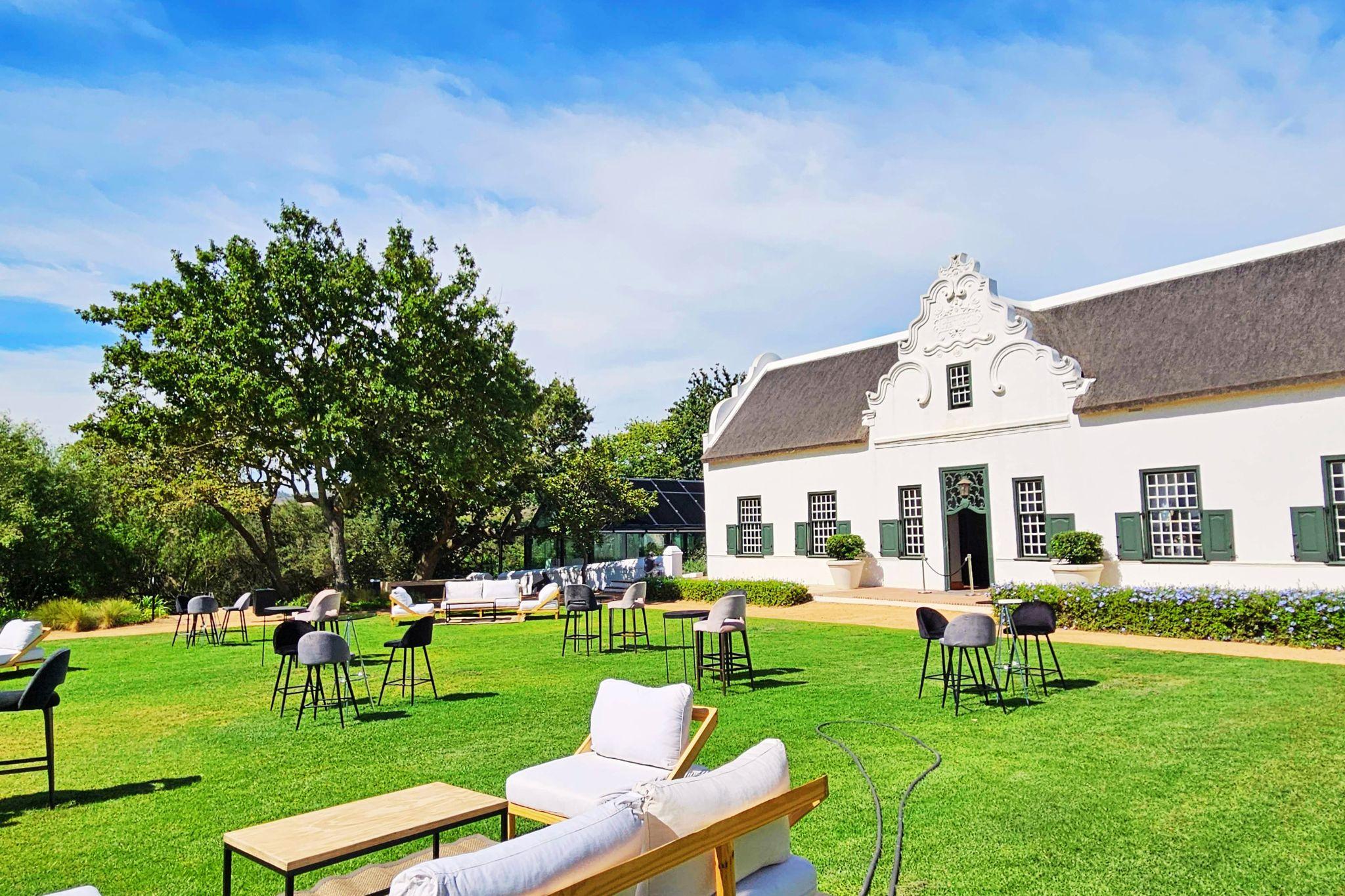 A Cape Dutch wine estate manor house near Cape Vine with wine tasting on the landscaped lawns