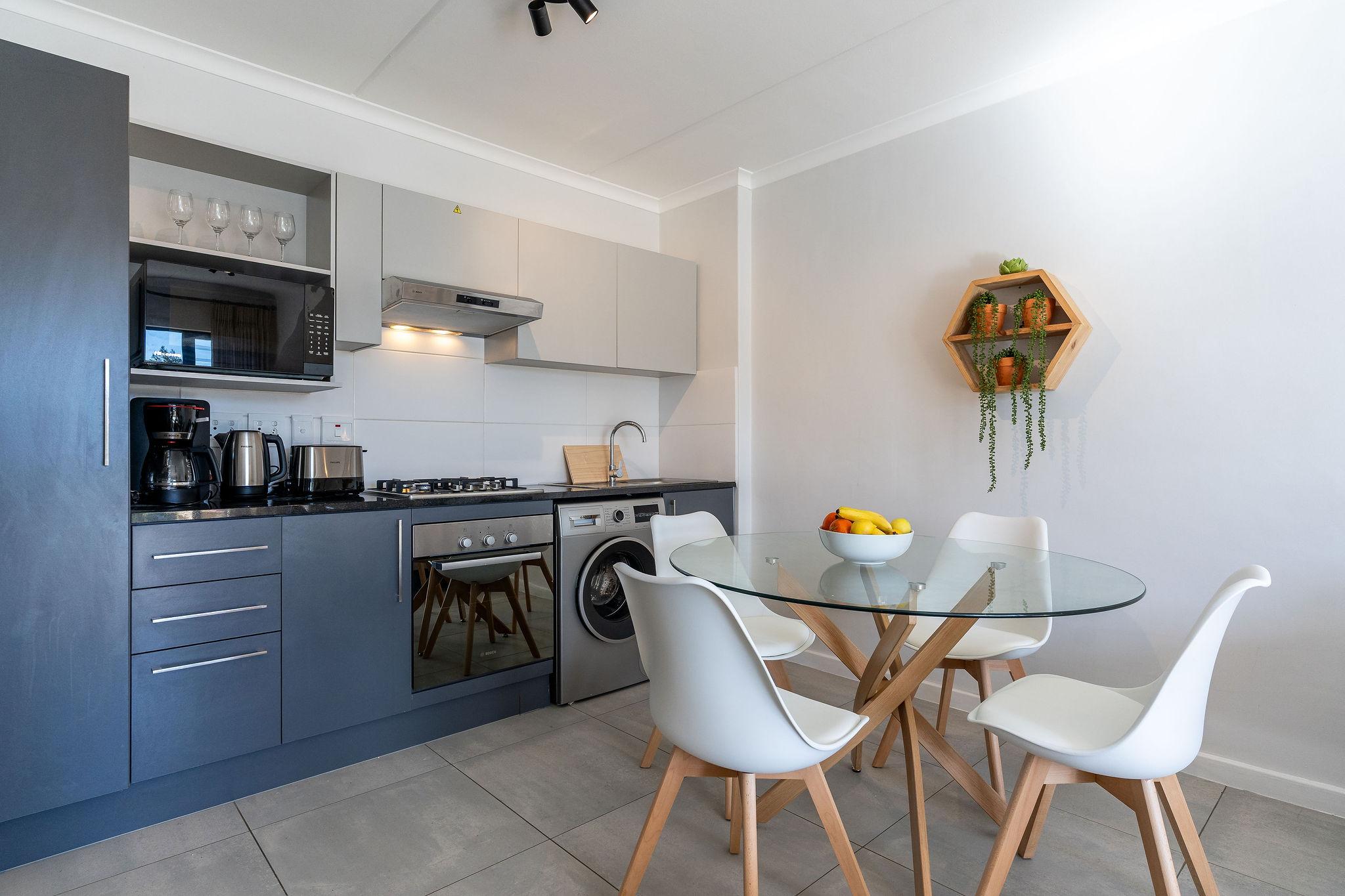 Cape Vine kitchen with gas hob, oven and washing machine