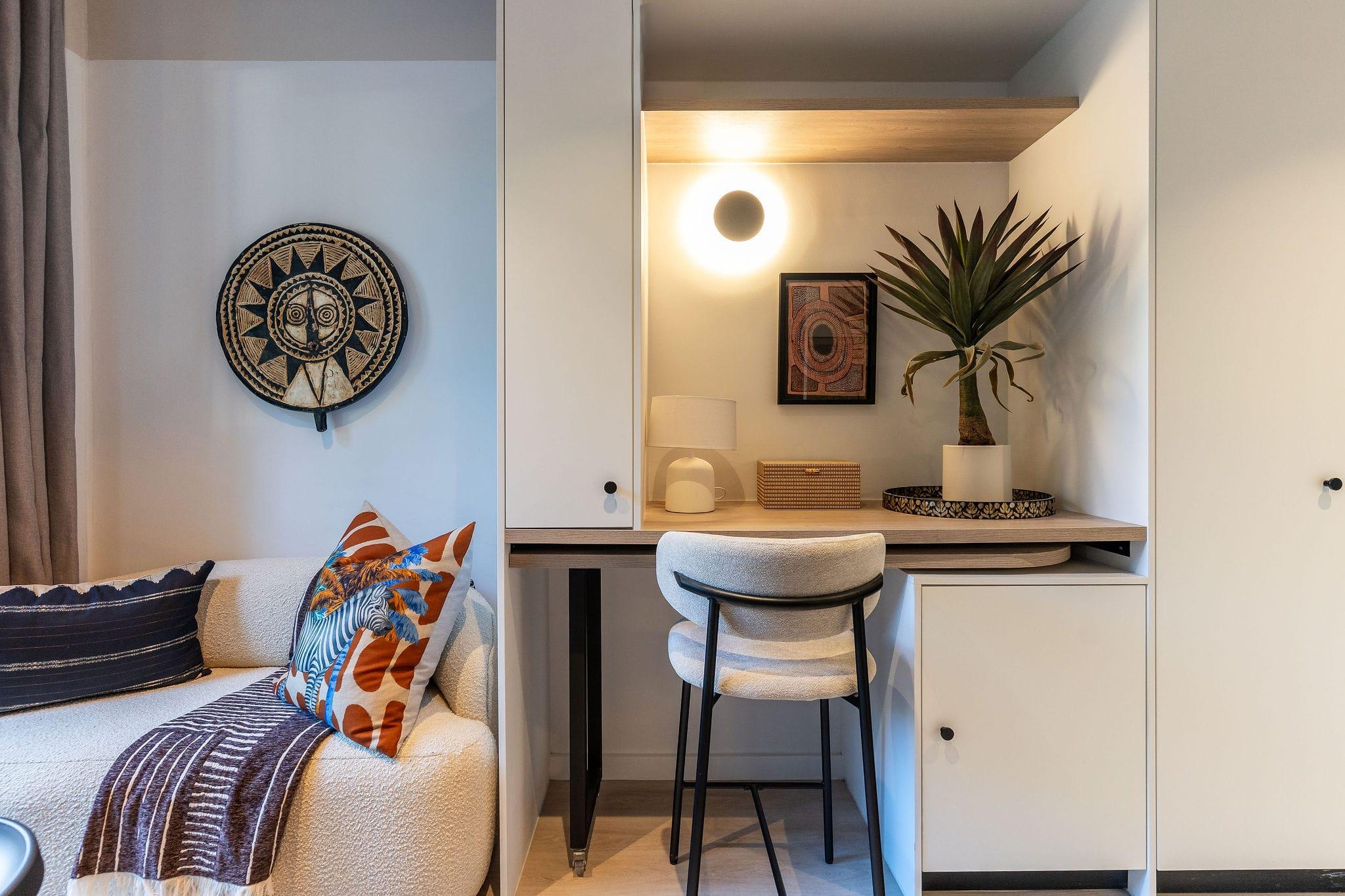 Centrepark desk nook with African wall art and a cream daybed sofa