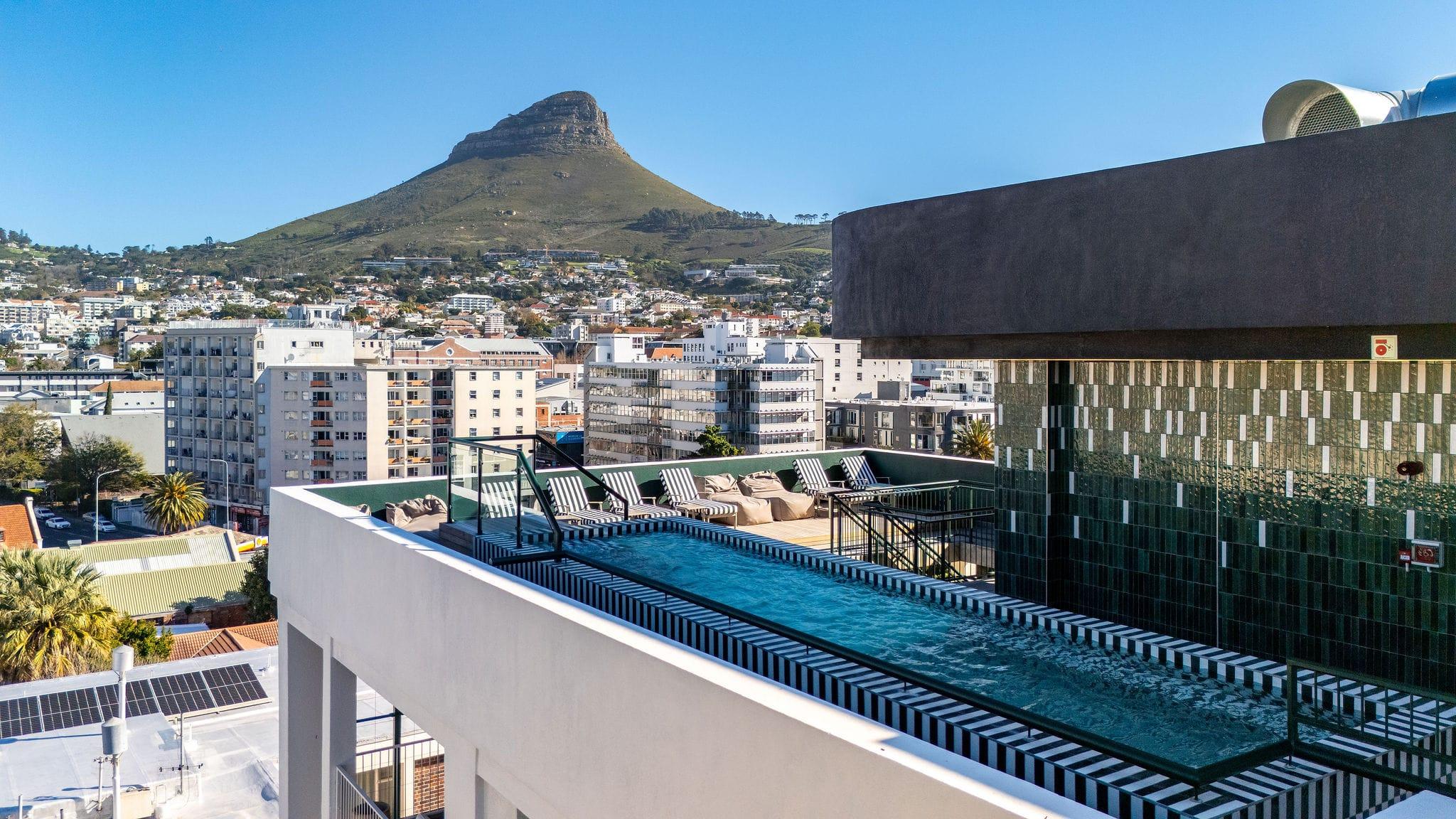 Ten on V rooftop pool deck framed by Lion's Head