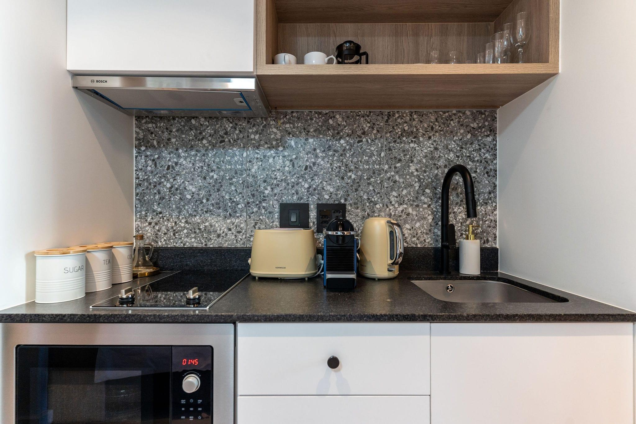 Mountainview kitchenette with terrazzo splashback, toaster and kettle